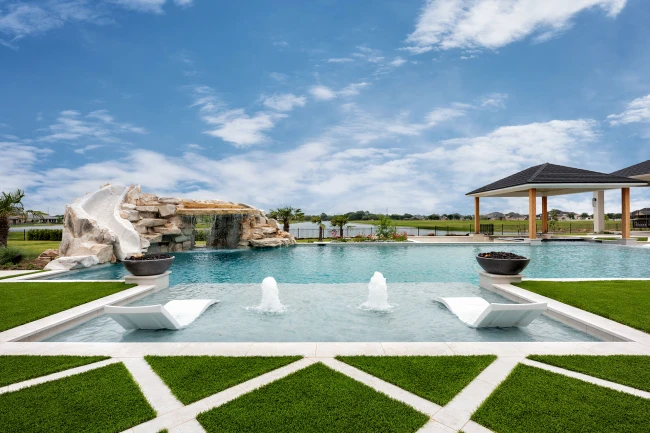 Custom pool with LED lighting and raised stone wall