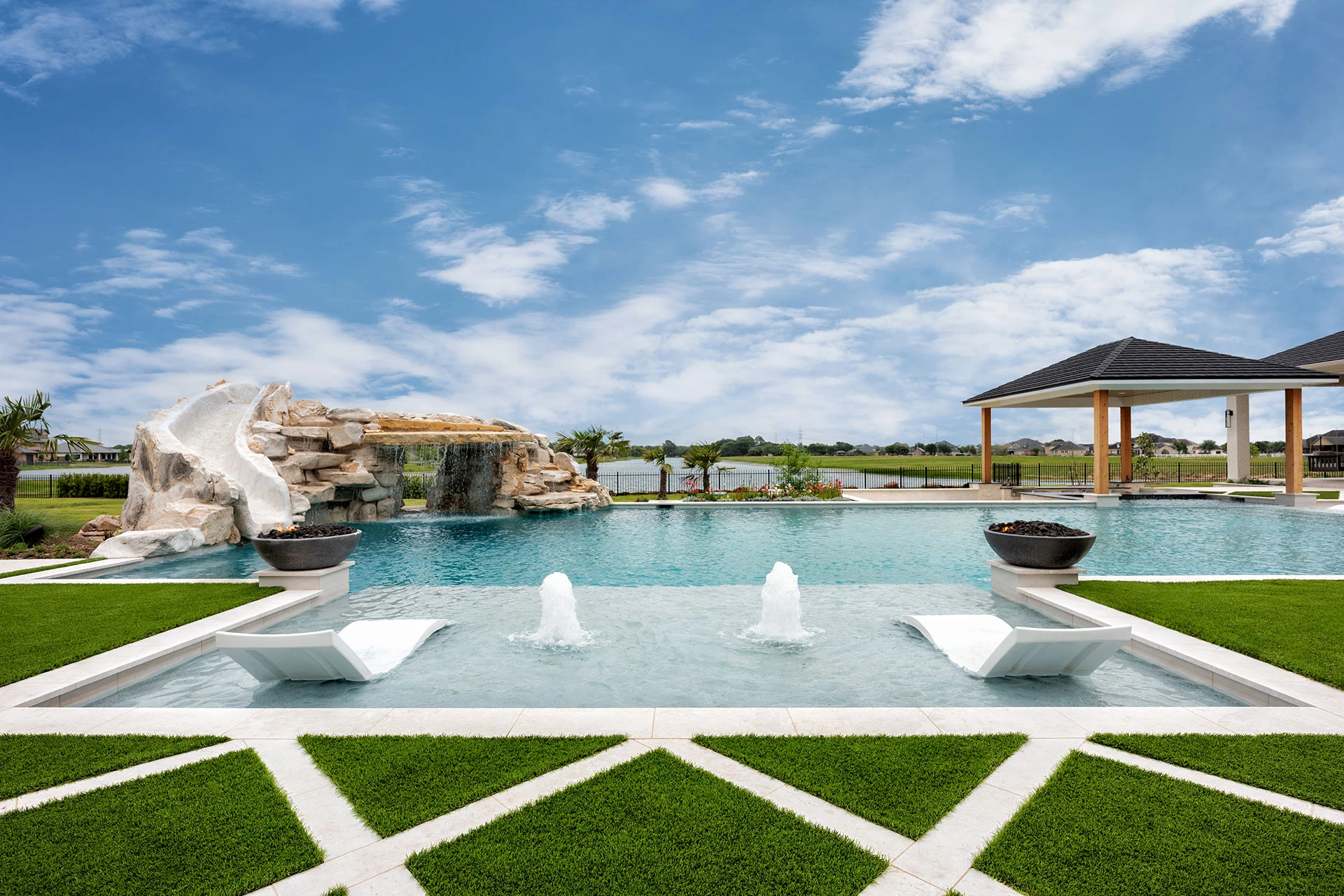 Custom pool with LED lighting and raised stone wall