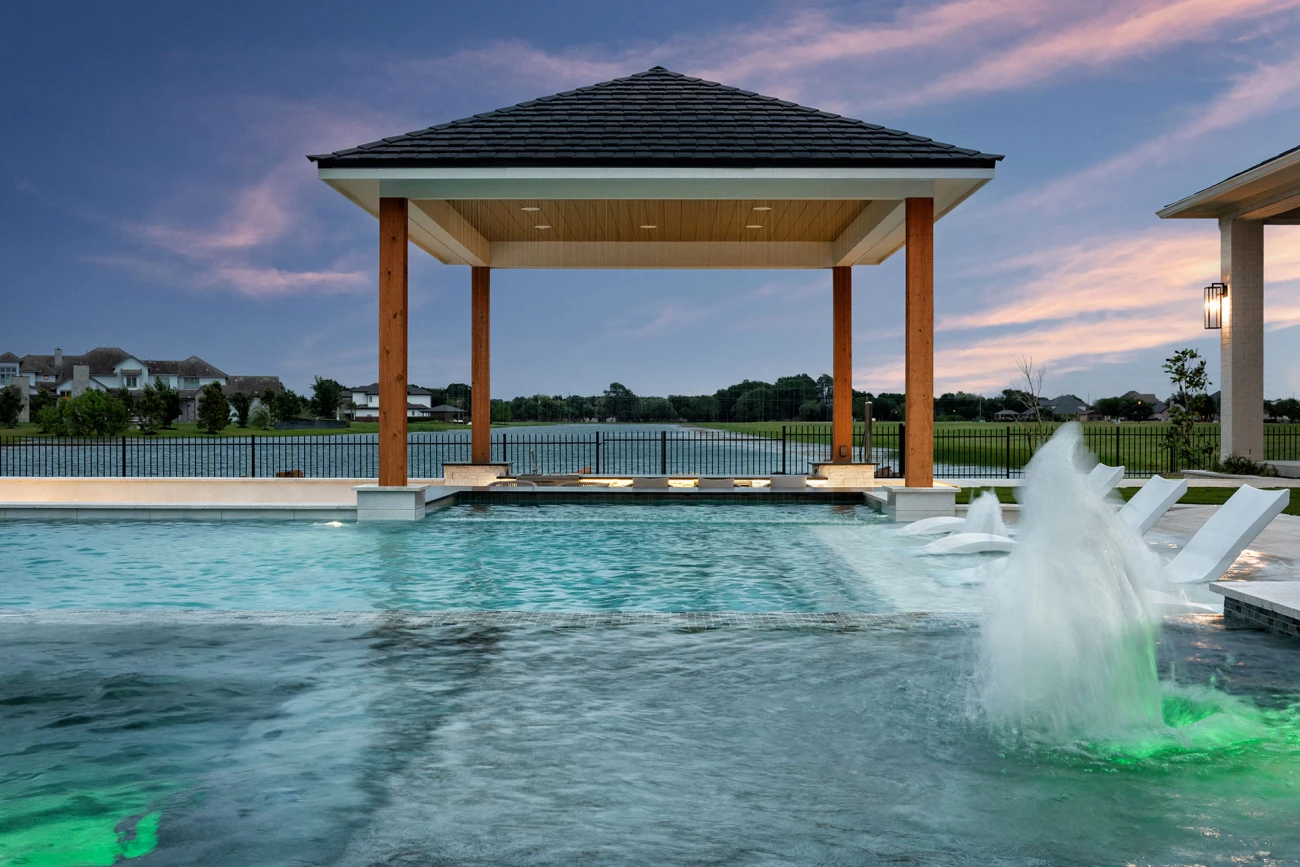 Aerial view of spacious outdoor living area with pool and pergola