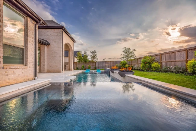 Luxury custom pool with spa combo and raised walls in Katy, TX