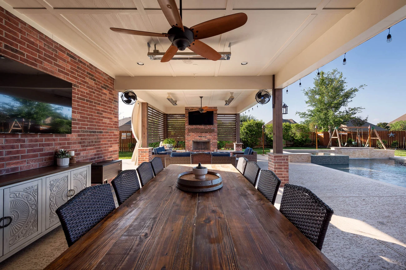 Outdoor living area with custom pool and kitchen setup