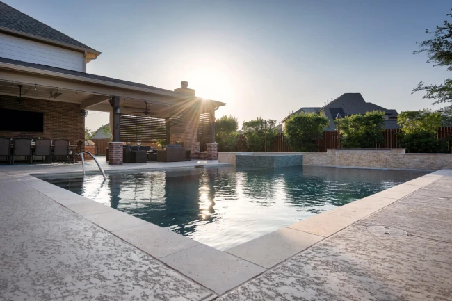 Sunset view of elegant pool with ambient LED lighting