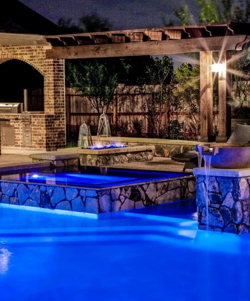a pool with a fountain and a barbeque - houston, tx