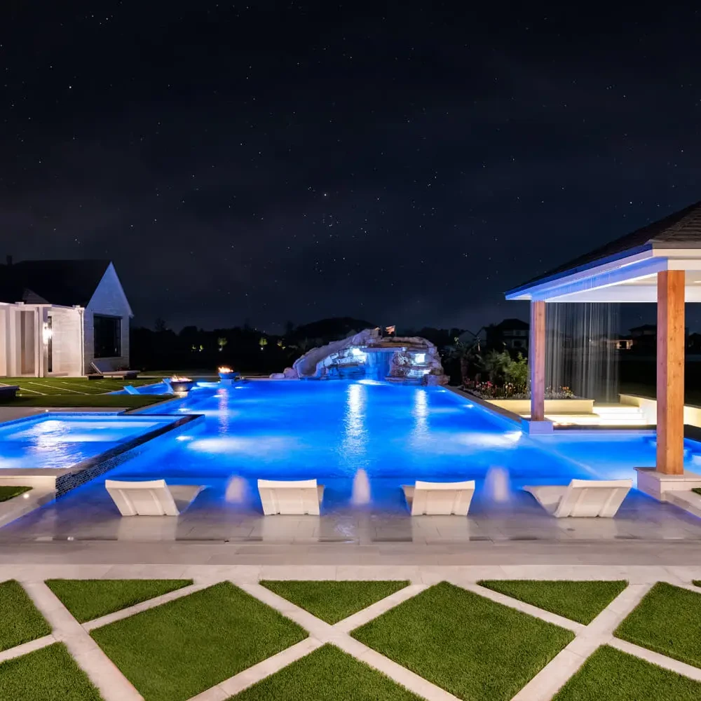 sunset pools katy pool builder luxury pool at night